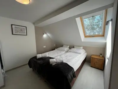 Łóżko lub łóżka w pokoju w obiekcie Apartament Rodzinny