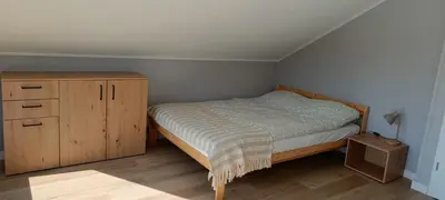 Łóżko lub łóżka w pokoju w obiekcie Domek Wilk