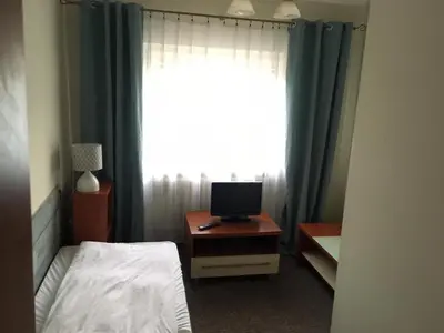 Łóżko lub łóżka w pokoju w obiekcie Grodzka B&B