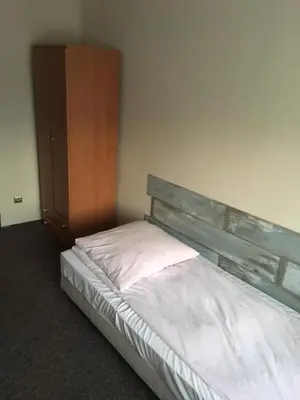 Łóżko lub łóżka w pokoju w obiekcie Grodzka B&B