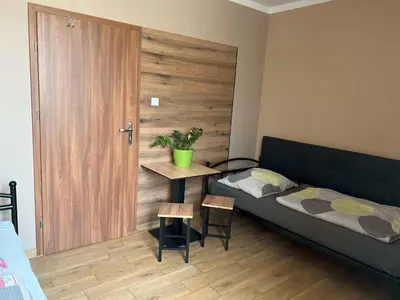 Łóżko lub łóżka w pokoju w obiekcie Pokoje AE BERG