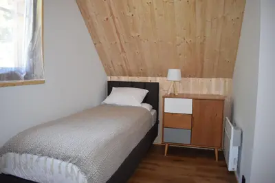 Łóżko lub łóżka w pokoju w obiekcie Borówkowa Dolina