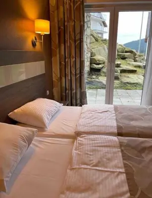 Łóżko lub łóżka w pokoju w obiekcie Apartament Czarna Góra Tignes 1