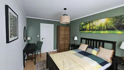 Łóżko lub łóżka w pokoju w obiekcie Kotsisa Apartament Wrocław