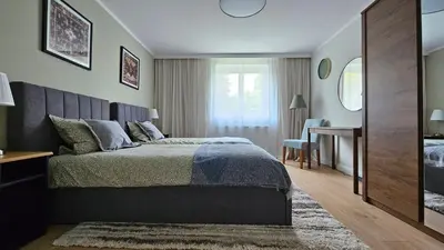 Łóżko lub łóżka w pokoju w obiekcie Kotsisa Apartament Wrocław