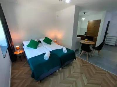 Łóżko lub łóżka w pokoju w obiekcie Apartamenty Monte Cassino