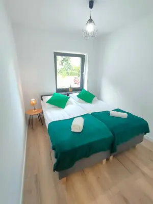 Łóżko lub łóżka w pokoju w obiekcie Apartamenty Monte Cassino