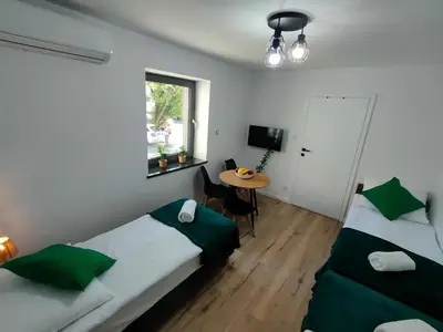 Łóżko lub łóżka w pokoju w obiekcie Apartamenty Monte Cassino