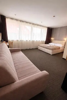 Łóżko lub łóżka w pokoju w obiekcie Willa Alexia