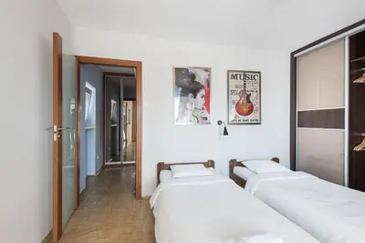 Łóżko lub łóżka w pokoju w obiekcie Samba Apartment