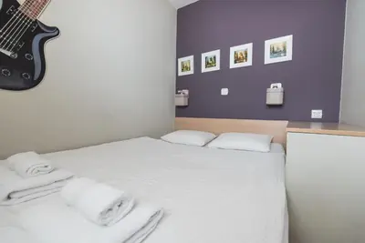 Łóżko lub łóżka w pokoju w obiekcie Samba Apartment