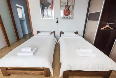 Łóżko lub łóżka w pokoju w obiekcie Samba Apartment