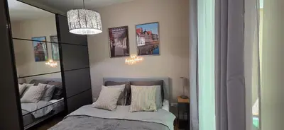 Łóżko lub łóżka w pokoju w obiekcie Fairytales Apartment River Point