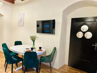 Telewizja i/lub zestaw kina domowego w obiekcie Katedralna Apartamenty