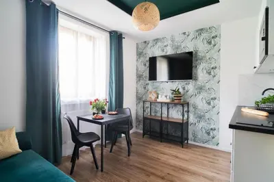 Telewizja i/lub zestaw kina domowego w obiekcie Katedralna Apartamenty