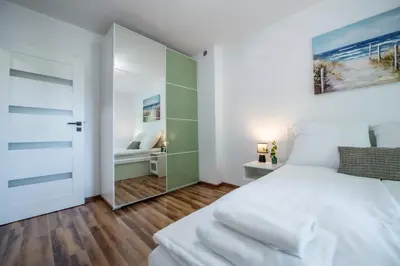 Łóżko lub łóżka w pokoju w obiekcie Apartament Lipowa 26