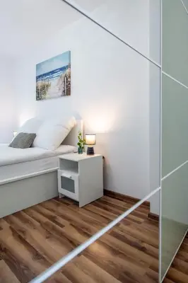 Łóżko lub łóżka w pokoju w obiekcie Apartament Lipowa 26