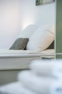 Łóżko lub łóżka w pokoju w obiekcie Apartament Lipowa 26