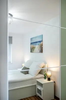 Łóżko lub łóżka w pokoju w obiekcie Apartament Lipowa 26