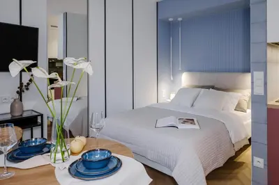 Łóżko lub łóżka w pokoju w obiekcie VelaLux Apartment
