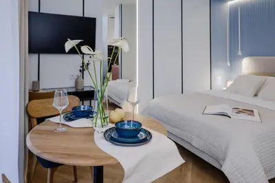 Łóżko lub łóżka w pokoju w obiekcie VelaLux Apartment