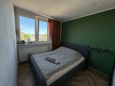 Łóżko lub łóżka w pokoju w obiekcie ApartamentsByMatyrafa-XIII