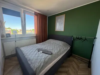 Łóżko lub łóżka w pokoju w obiekcie ApartamentsByMatyrafa-XIII