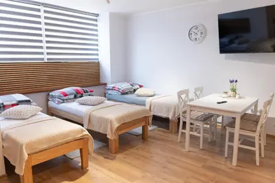Łóżko lub łóżka w pokoju w obiekcie Apartamenty 592 2
