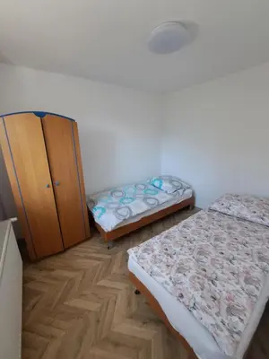 Łóżko lub łóżka w pokoju w obiekcie Pokoje na Bocznej