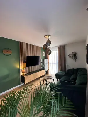 Telewizja i/lub zestaw kina domowego w obiekcie COMO Apartment parking podziemny
