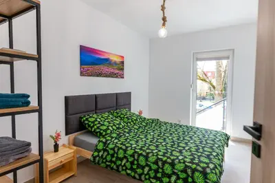Łóżko lub łóżka w pokoju w obiekcie Apartament Przystanek Kudowa Centrum