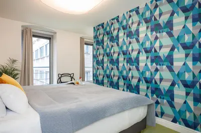 Łóżko lub łóżka w pokoju w obiekcie Classy Apartments Ruska - Tanie Apartamenty na Rynku