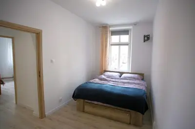 Łóżko lub łóżka w pokoju w obiekcie Apartament Arpika