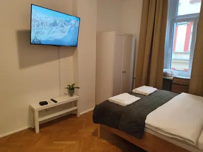 Łóżko lub łóżka w pokoju w obiekcie Apartament Rzeźnicza 25 - Rynek