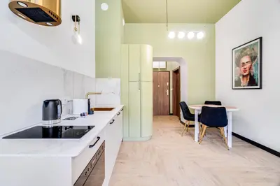 Kuchnia lub aneks kuchenny w obiekcie Sienkiewicza 32A by Homeprime