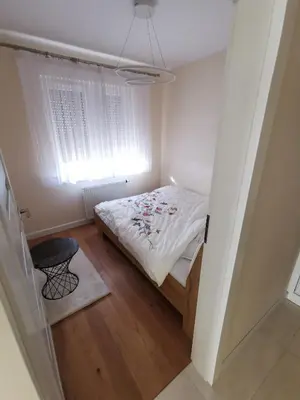 Łóżko lub łóżka w pokoju w obiekcie APARTMENT Wieluń 56 m