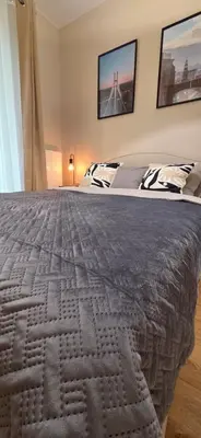 Łóżko lub łóżka w pokoju w obiekcie Fairytales Apartment River Point II