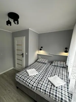 Łóżko lub łóżka w pokoju w obiekcie Apartament nad Nysą Kłodzką