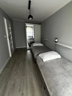 Łóżko lub łóżka w pokoju w obiekcie Apartament nad Nysą Kłodzką