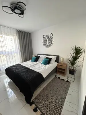 Łóżko lub łóżka w pokoju w obiekcie Apartament Dobrzec