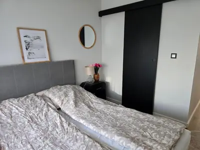 Łóżko lub łóżka w pokoju w obiekcie ApartPodmiejska