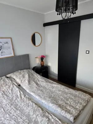 Łóżko lub łóżka w pokoju w obiekcie ApartPodmiejska