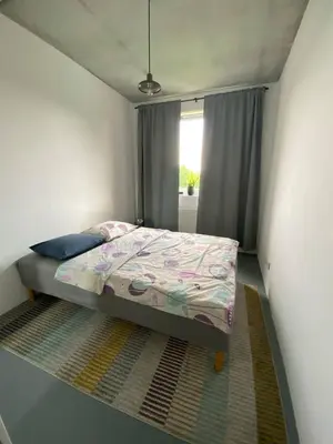 Łóżko lub łóżka w pokoju w obiekcie Mieszkanie w stylu Loft