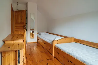 Łóżko lub łóżka w pokoju w obiekcie Pod Pustelnikiem
