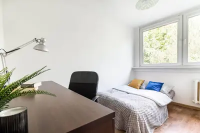 Łóżko lub łóżka w pokoju w obiekcie CityStay Młodych Techników