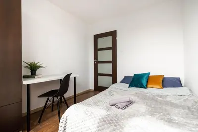 Łóżko lub łóżka w pokoju w obiekcie CityStay Młodych Techników