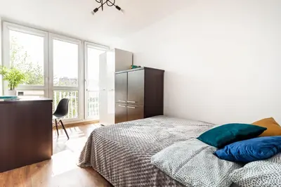 Łóżko lub łóżka w pokoju w obiekcie CityStay Młodych Techników