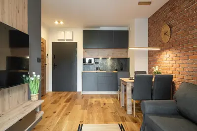 Kuchnia lub aneks kuchenny w obiekcie RentPlanet - Sienkiewicza Residence