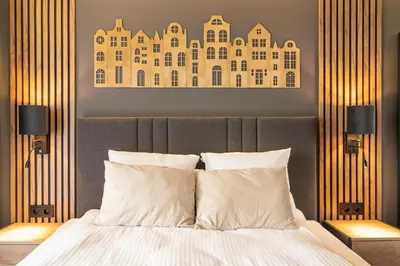 Łóżko lub łóżka w pokoju w obiekcie RentPlanet - Sienkiewicza Residence