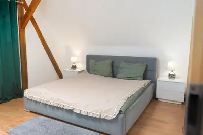 Łóżko lub łóżka w pokoju w obiekcie Apartament Przyjemna Opole